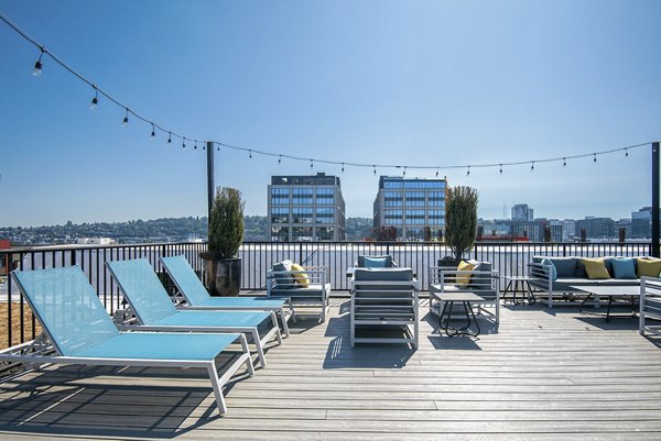 Expansive patio with modern seating at 708 Uptown Apartments, ideal for relaxation and social gatherings in a luxury urban setting