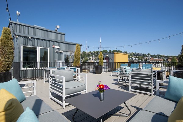 Stylish patio with modern furniture at 708 Uptown Apartments, perfect for outdoor gatherings and relaxation