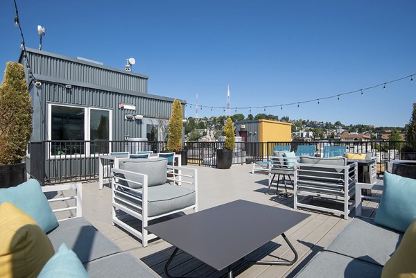 Patio at 708 Uptown Apartments with modern furniture and city views