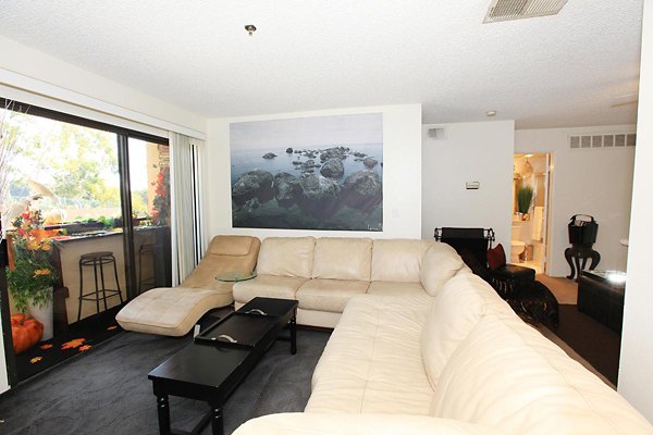 Spacious living room with modern furnishings at City View Apartments, featuring luxury design and comfort for urban living