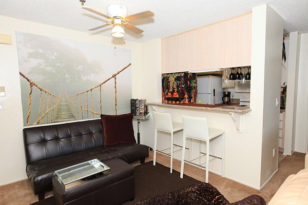 City View Apartments: Modern living room with elegant furnishings and large windows, offering stunning views in luxury apartments
