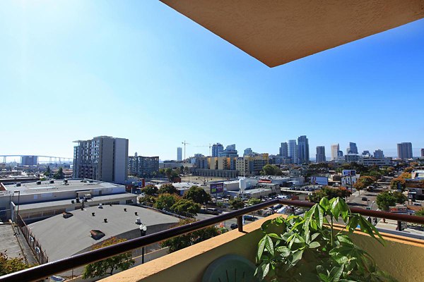 Scenic skyline views from a furnished balcony at City View Apartments