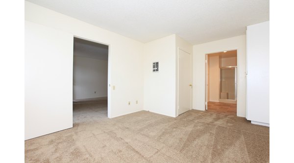 Cozy bedroom with ocean views at Ocean Breeze Apartments, featuring elegant decor and luxury amenities