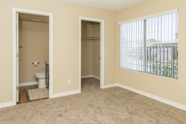 Spacious bedroom with elegant decor at Whispering Oaks Apartments, a luxury offering by Greystar