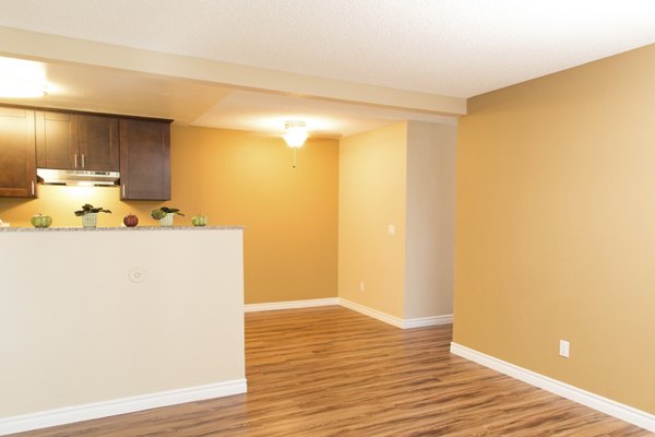 Elegant dining room with modern decor at Whispering Oaks Apartments, luxury living offered by Greystar