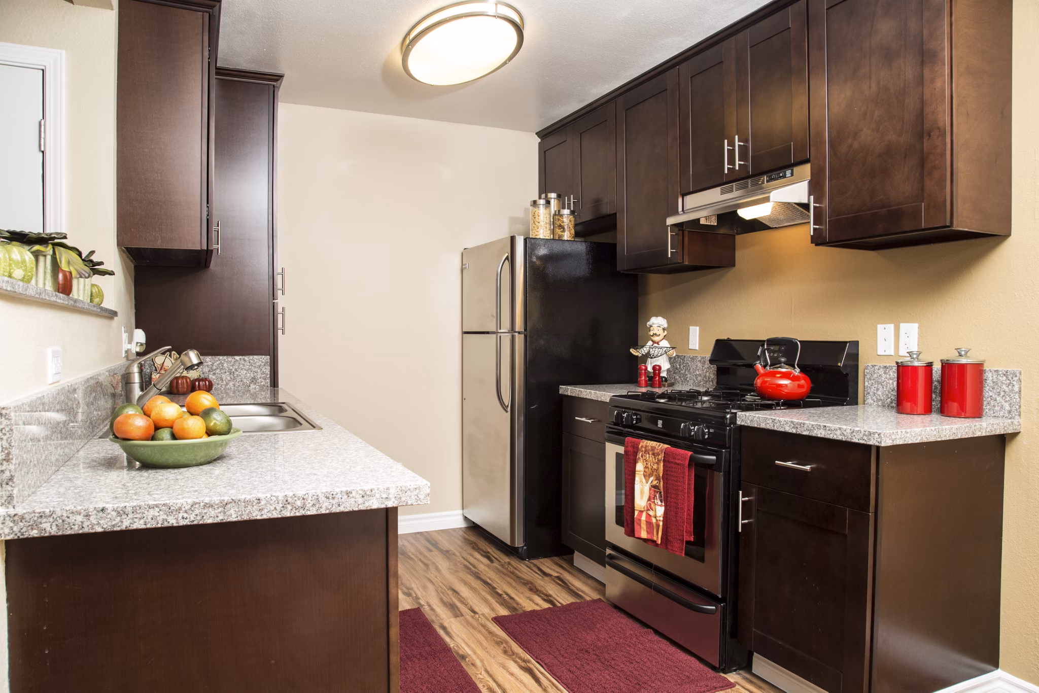 Modern kitchen with stainless appliances at Whispering Oaks Apartments, Greystar luxury apartments
