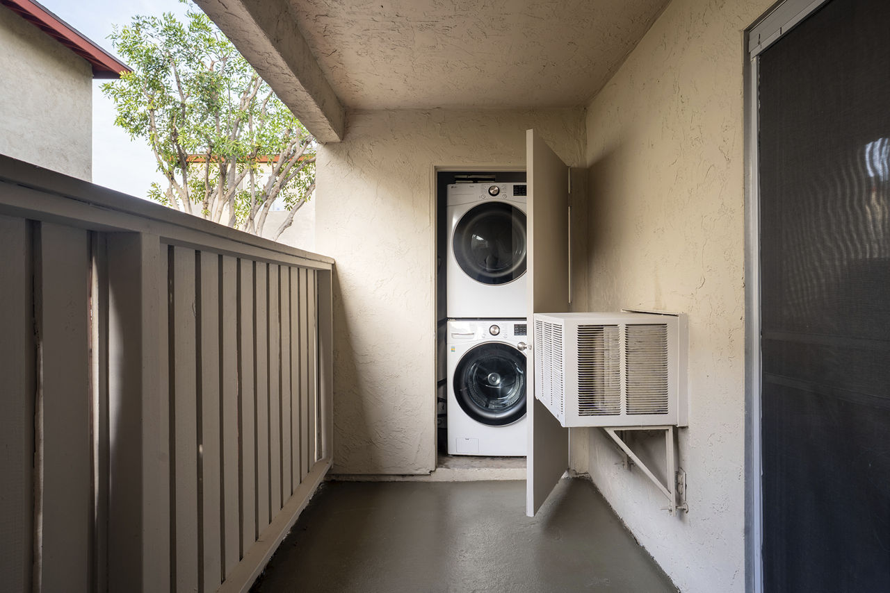 Laundry room at Whispering Oaks Apartments