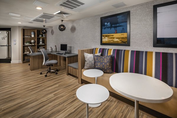 Clubhouse featuring modern design and open seating at The Pointe at Warner Center Apartments