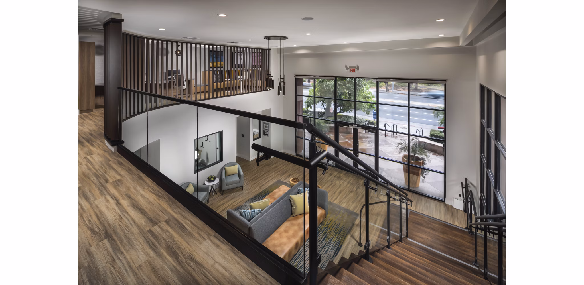 Clubhouse with modern decor and ample seating at The Pointe at Warner Center Apartments