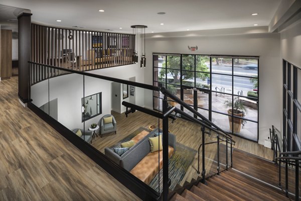 Clubhouse with modern decor and ample seating at The Pointe at Warner Center Apartments