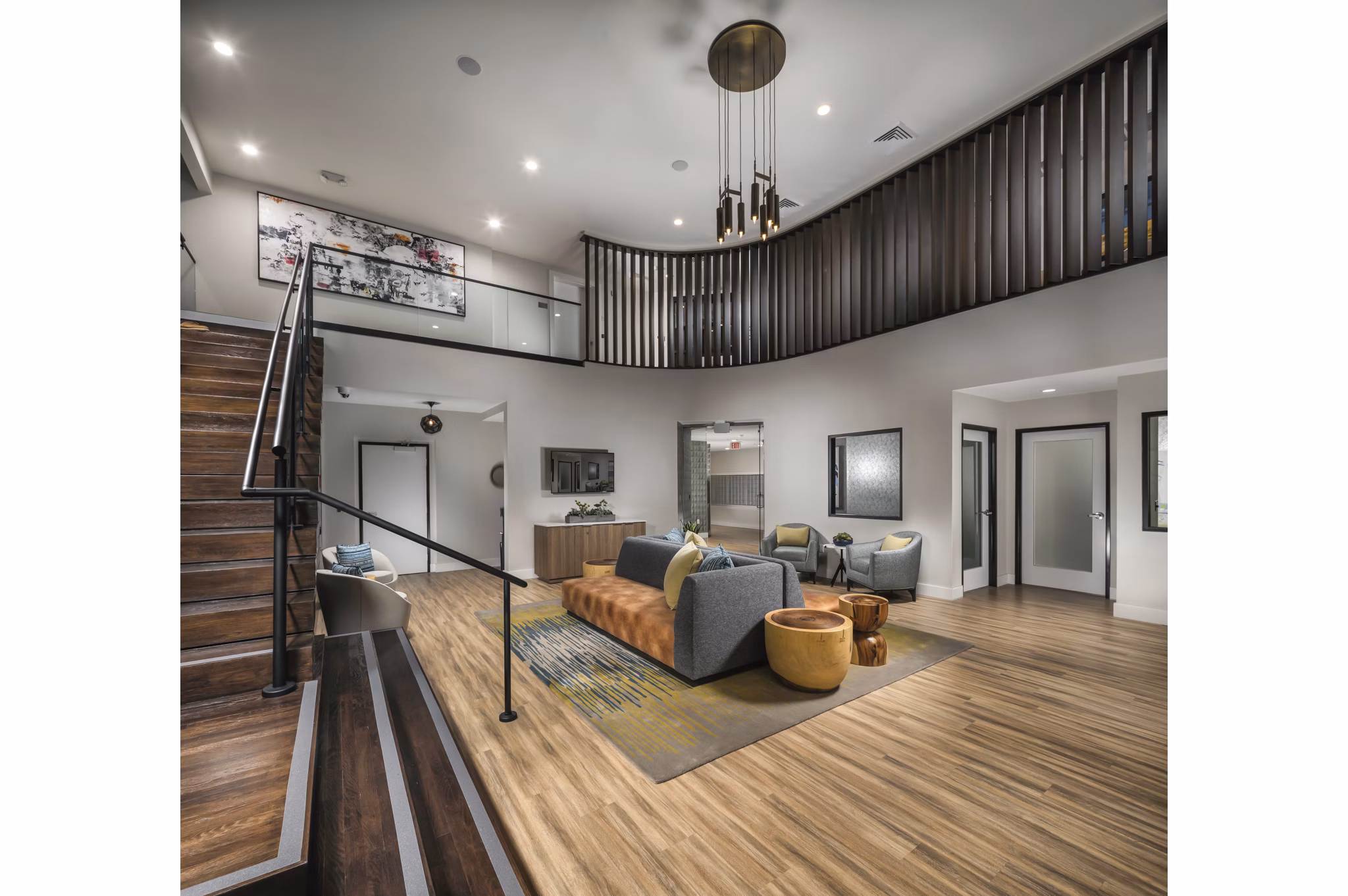 Clubhouse featuring modern design and plush seating at The Pointe at Warner Center Apartments