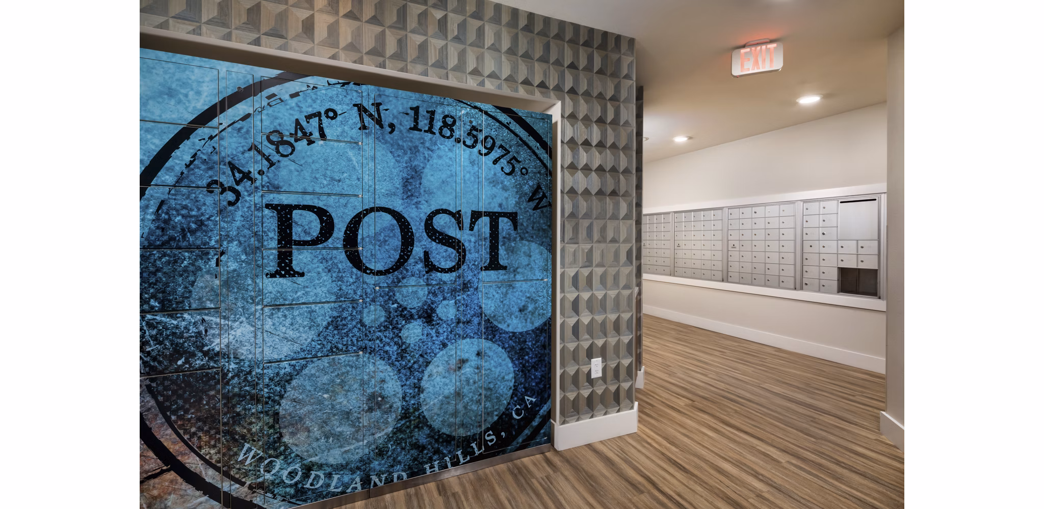 Mail room with organized parcel lockers at The Pointe at Warner Center Apartments