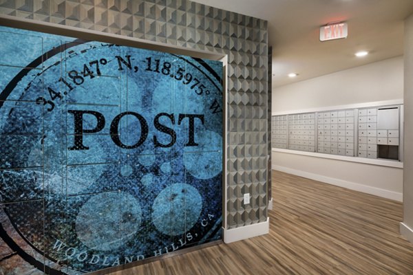 Mail room with organized parcel lockers at The Pointe at Warner Center Apartments