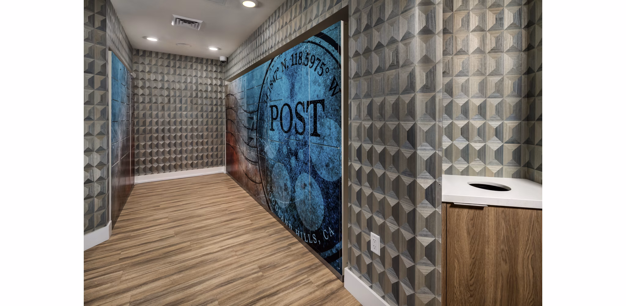 Mailroom with secured package lockers at The Pointe at Warner Center Apartments