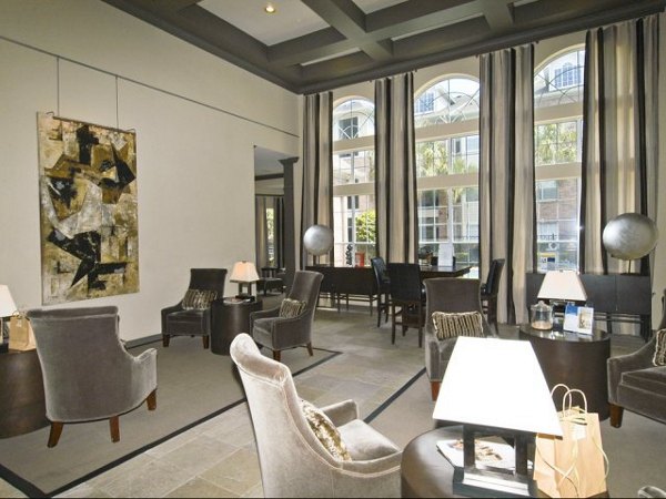 Clubhouse featuring modern design and cozy seating at Crossing at White Oak Apartments