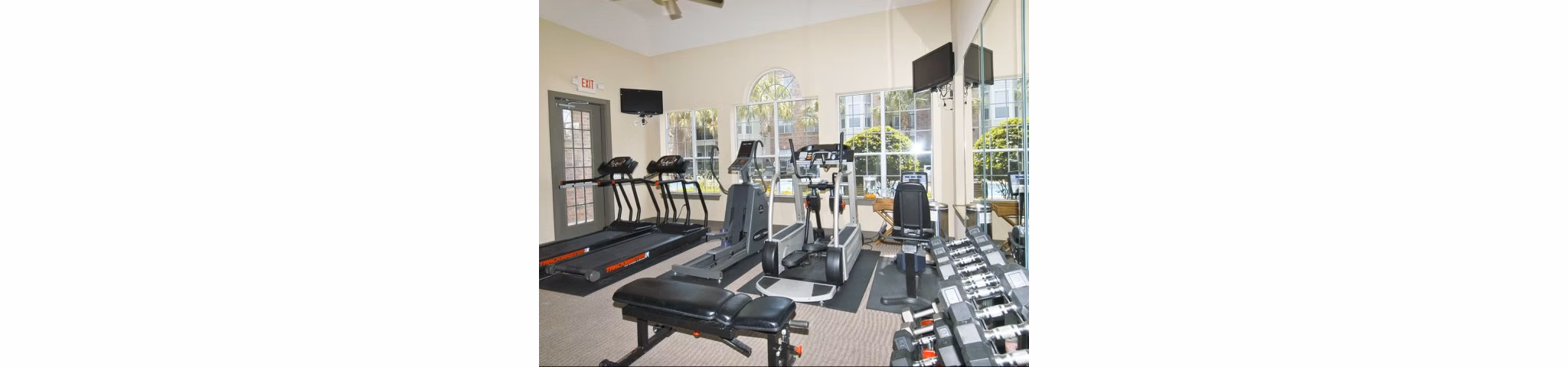 State-of-the-art fitness center at Crossing at White Oak Apartments, featuring modern equipment and spacious workout areas