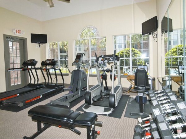 State-of-the-art fitness center at Crossing at White Oak Apartments, featuring modern equipment and spacious workout areas