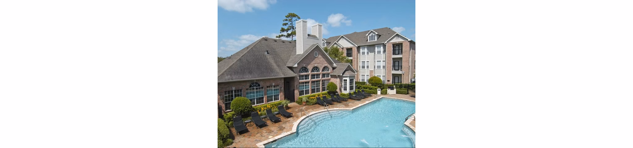 Resort-style pool at Crossing at White Oak Apartments offering luxury relaxation and recreation for residents
