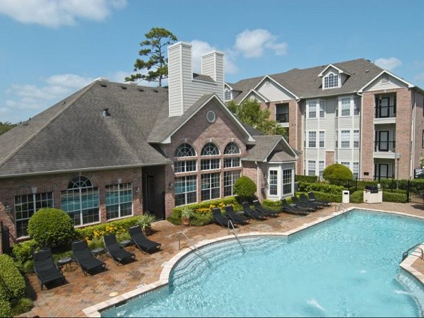 Resort-style pool at Crossing at White Oak Apartments offering luxury relaxation and recreation for residents
