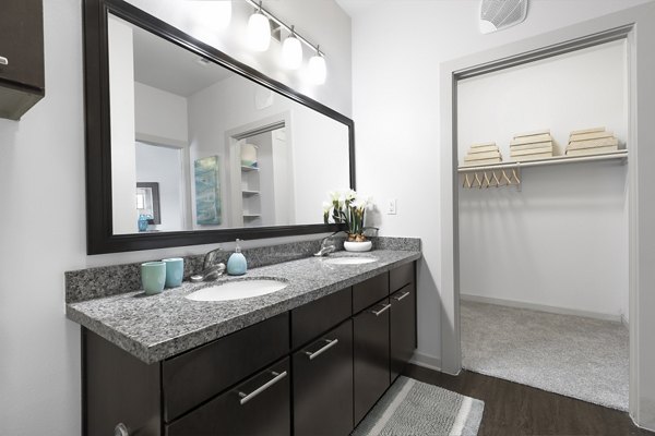 Modern bathroom with sleek fixtures at 95Twenty Apartments in luxury Greystar community