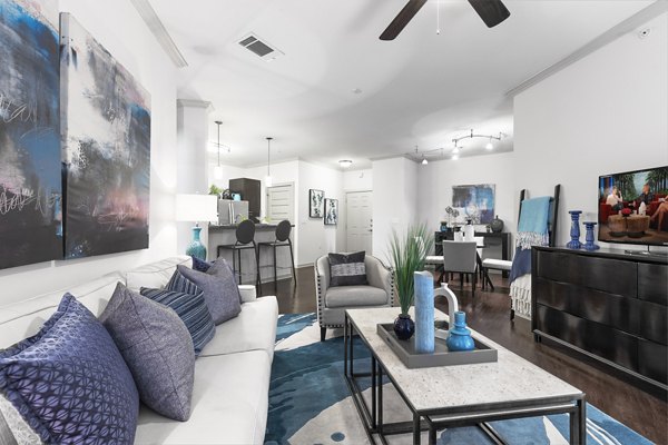 Living room with modern decor and natural light at 95Twenty Apartments
