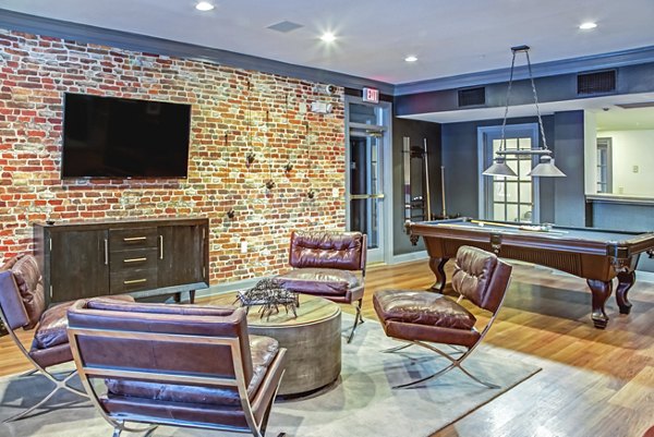 Elegant clubhouse interior with modern furnishings at Plaza at Westchase Apartments, perfect for luxury living and social gatherings