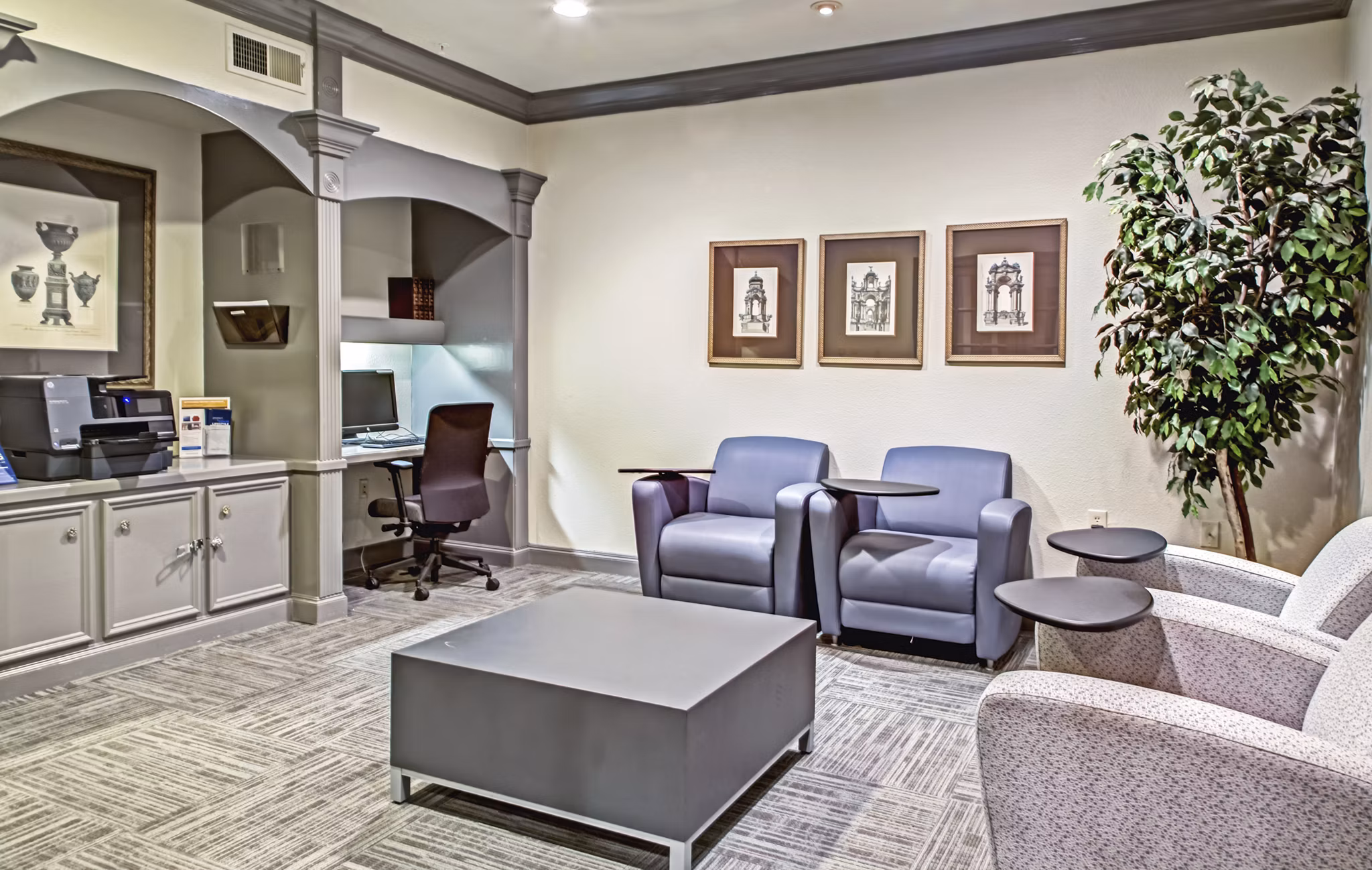 Elegant clubhouse featuring modern furnishings at Plaza at Westchase Apartments