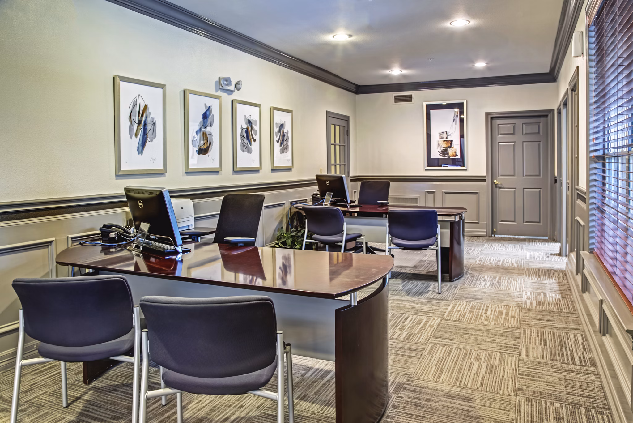 Clubhouse featuring modern seating and lighting at Plaza at Westchase Apartments