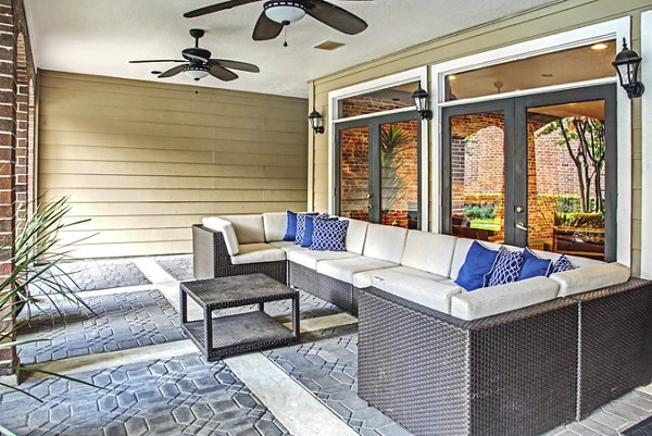Relaxing patio with modern seating at Plaza at Westchase Apartments