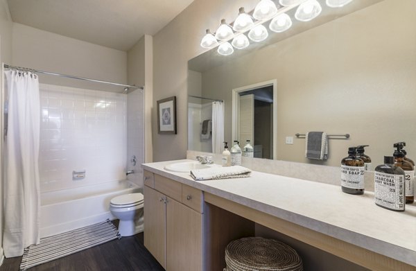 Modern bathroom with sleek fixtures at Avana Thornton Station Apartments, offering luxury living