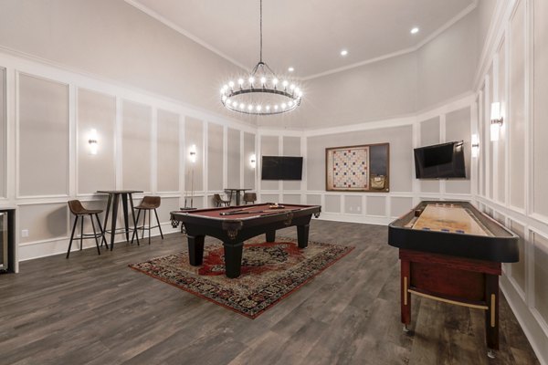 Game room with pool table and arcade games at Avana Thornton Station Apartments, luxury living near the heart of the action