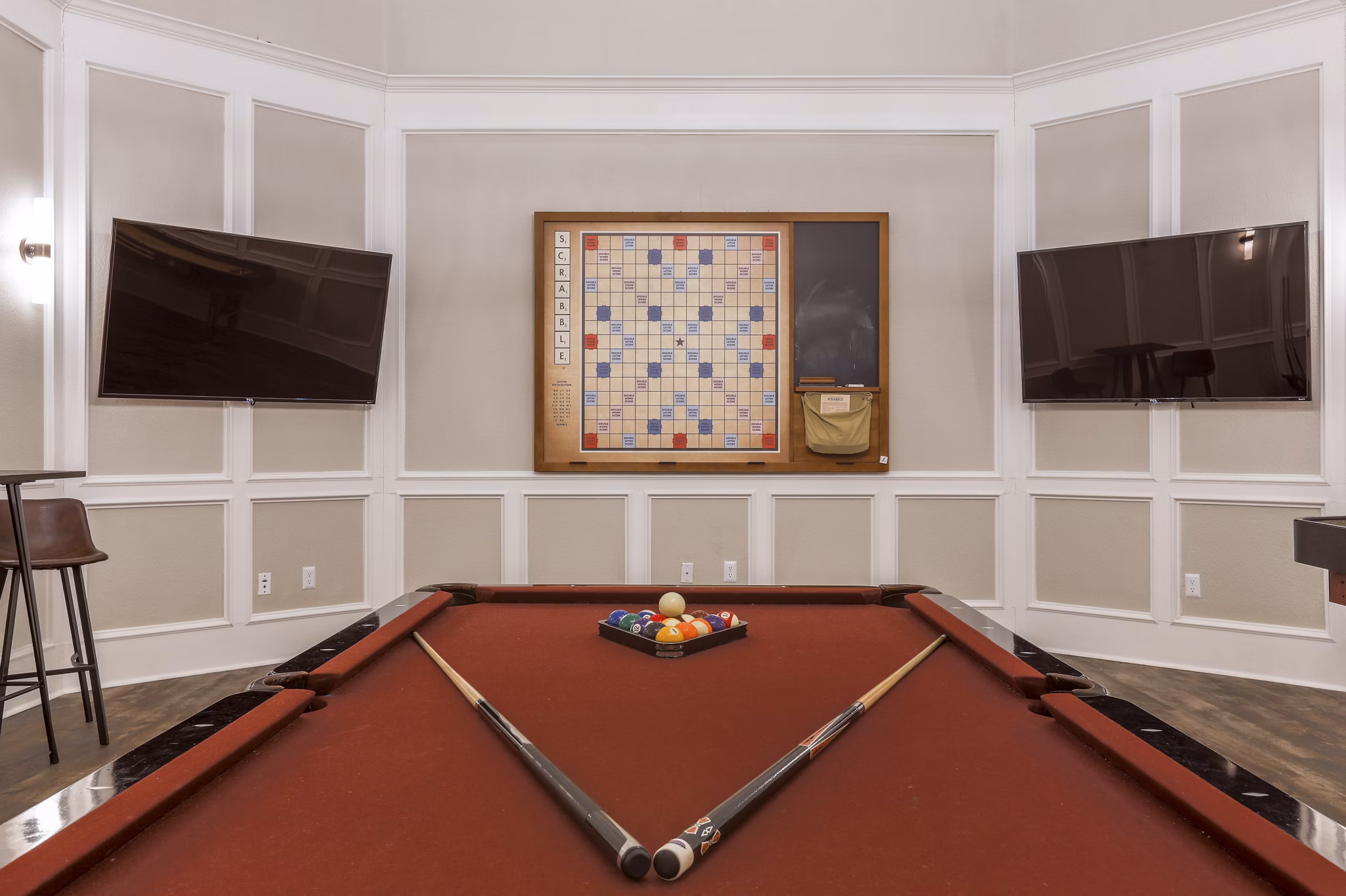 Game room with pool table and lounge seating at Avana Thornton Station Apartments