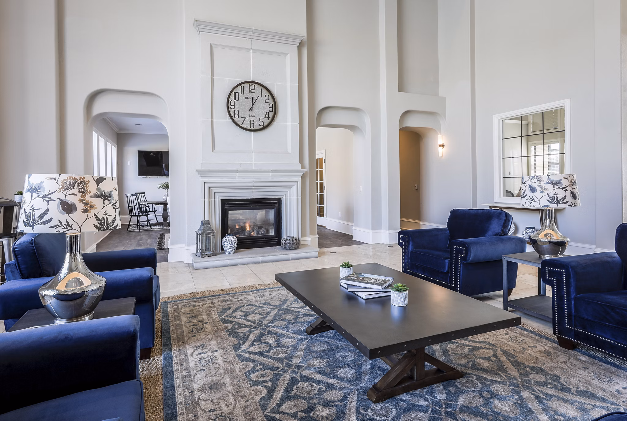 Modern clubhouse with cozy seating and fireplace at Avana Thornton Station Apartments