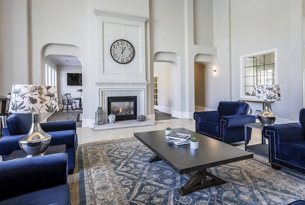 Modern clubhouse with cozy seating and fireplace at Avana Thornton Station Apartments