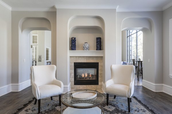 Clubhouse with modern seating and fireplace at Avana Thornton Station Apartments