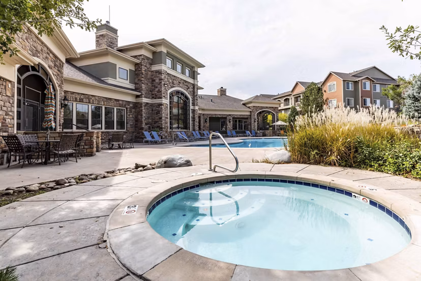 Relaxing outdoor pool area at Avana Thornton Station Apartments, ideal for leisure and entertainment
