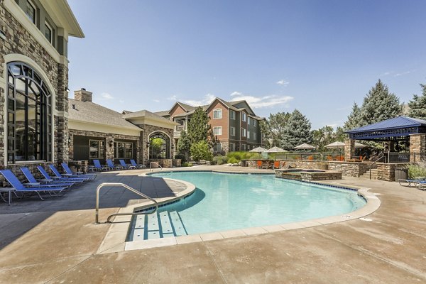 Relaxing outdoor pool area at Avana Thornton Station Apartments, ideal for leisure and entertainment