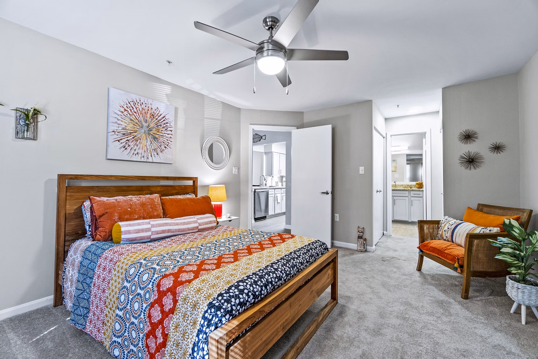 Ellipse at Fairfax Corner: Modern bedroom featuring cozy decor and ample natural light in luxury apartments