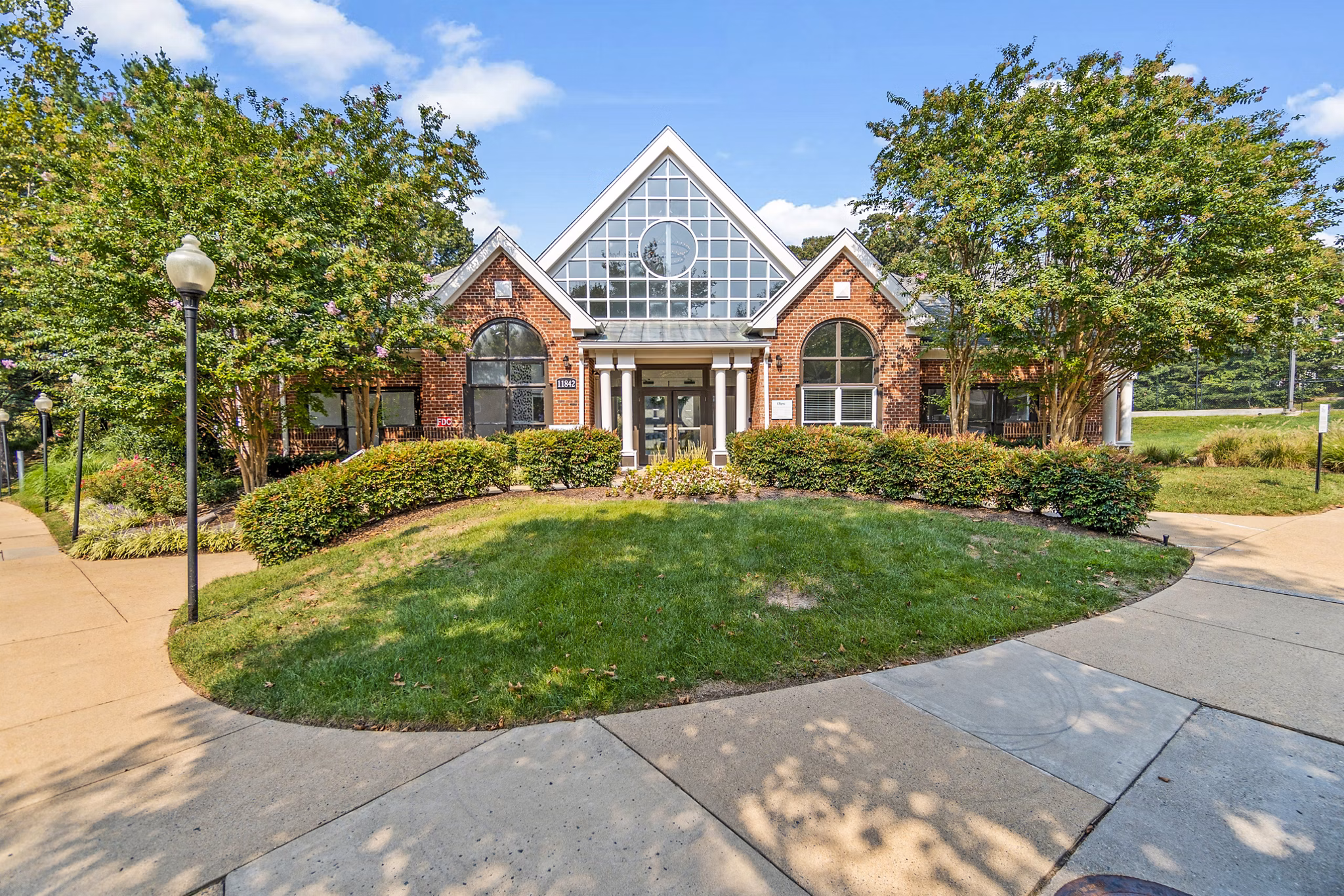 Clubhouse with modern design at Ellipse at Fairfax Corner Apartments, featuring luxury amenities for residents to enjoy