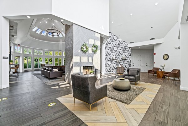 Stylish clubhouse lobby with modern decor at Ellipse at Fairfax Corner Apartments