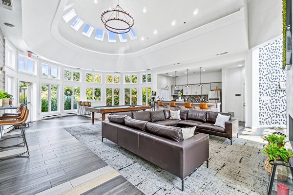 Clubhouse with modern seating and decor at Ellipse at Fairfax Corner Apartments