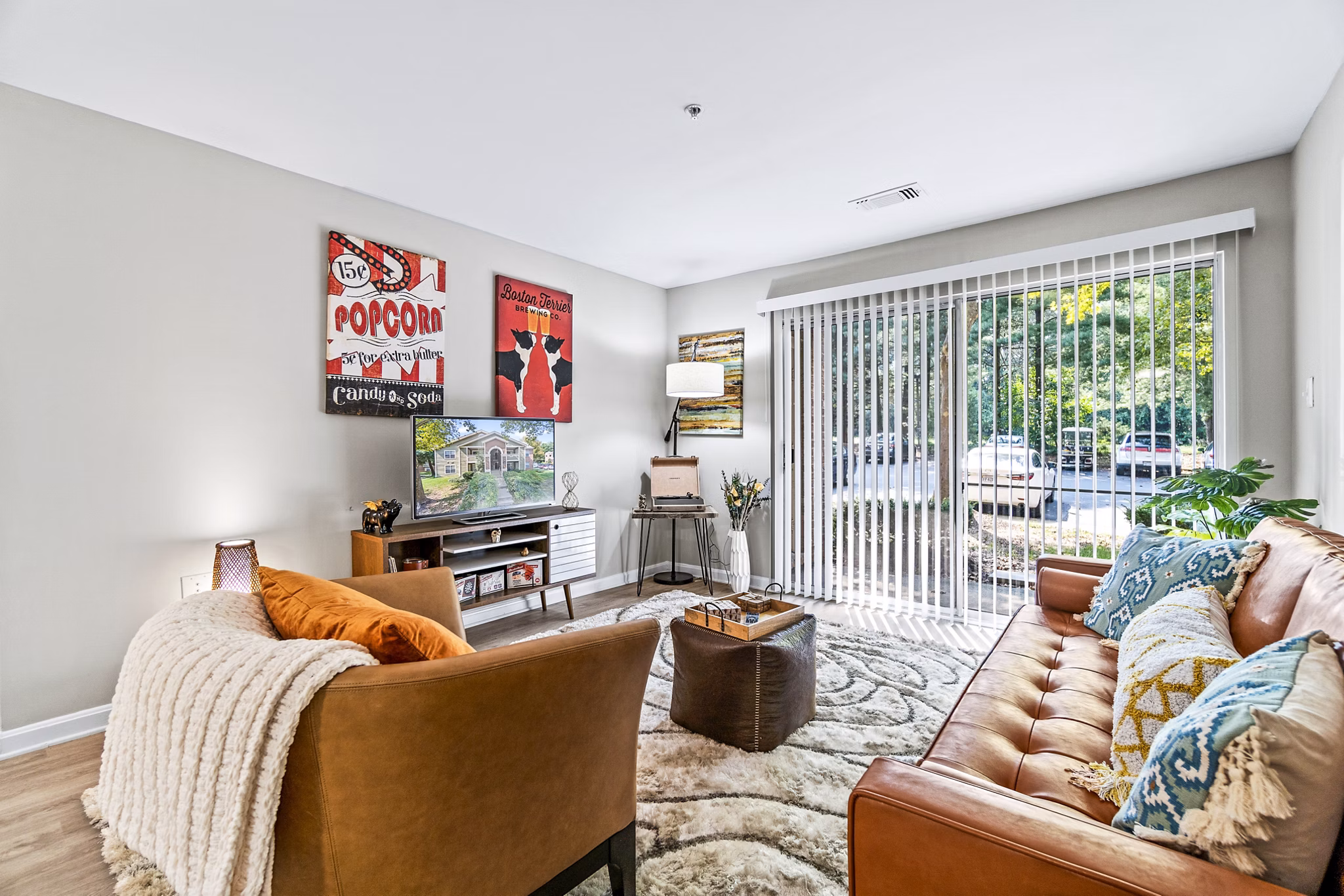 Spacious living room with modern decor in Ellipse at Fairfax Corner Apartments