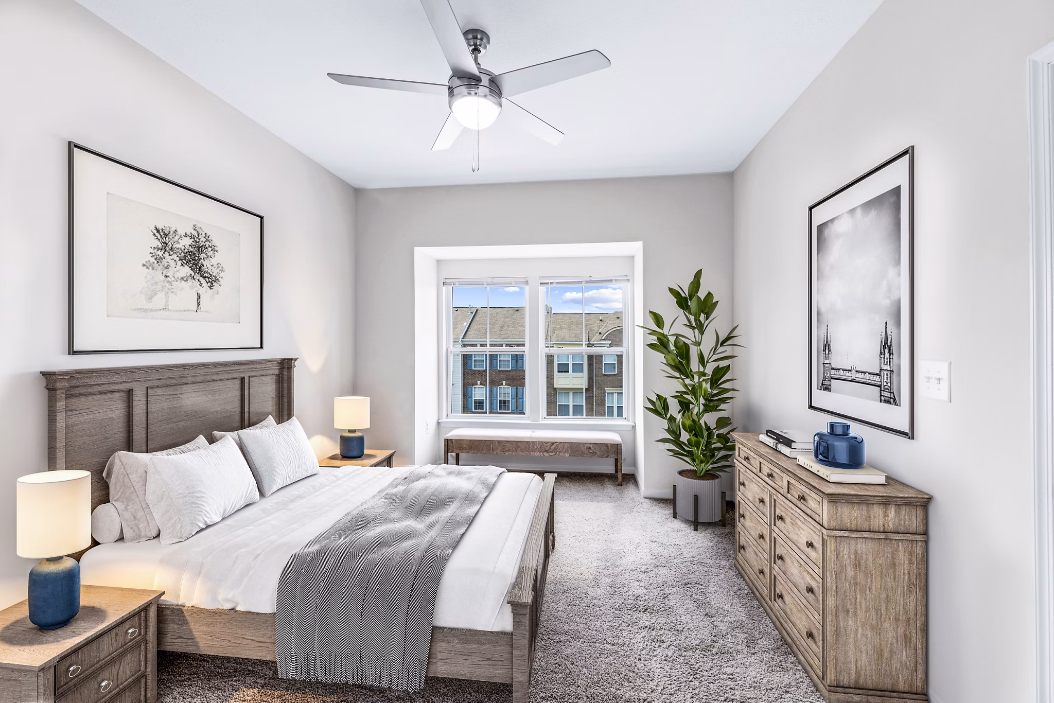 Bedroom with cozy ambiance and modern decor at Townes at Herndon Apartments, offering luxury living spaces for ultimate comfort and style