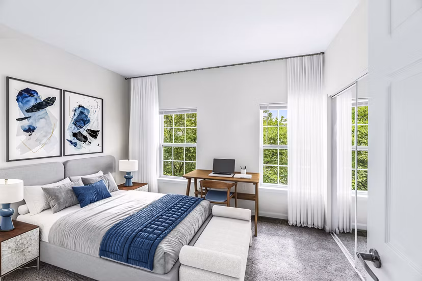 Cozy bedroom with modern furnishings at Townes at Herndon Apartments