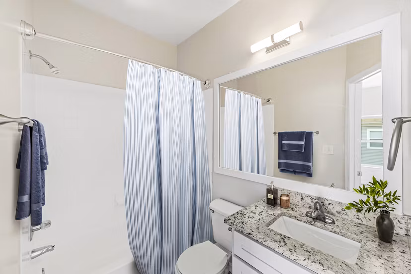 Stylish bathroom featuring modern fixtures at Townes at Herndon Apartments, offering luxury living and conveniences in a serene setting
