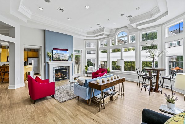 Elegant clubhouse featuring cozy seating areas at Townes at Herndon Apartments, perfect for social gatherings and community events