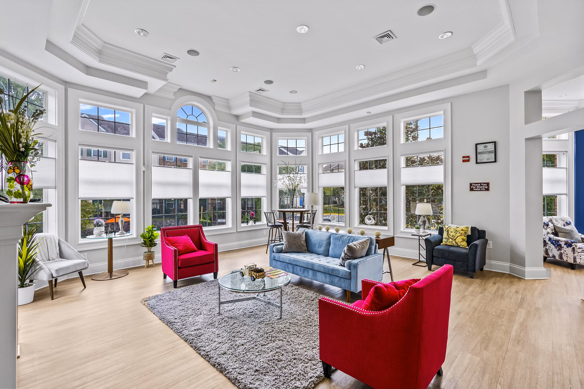 Clubhouse at Townes at Herndon Apartments featuring modern design and seating areas
