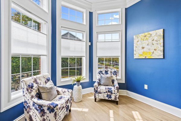 Clubhouse featuring modern design and comfortable seating at Townes at Herndon Apartments