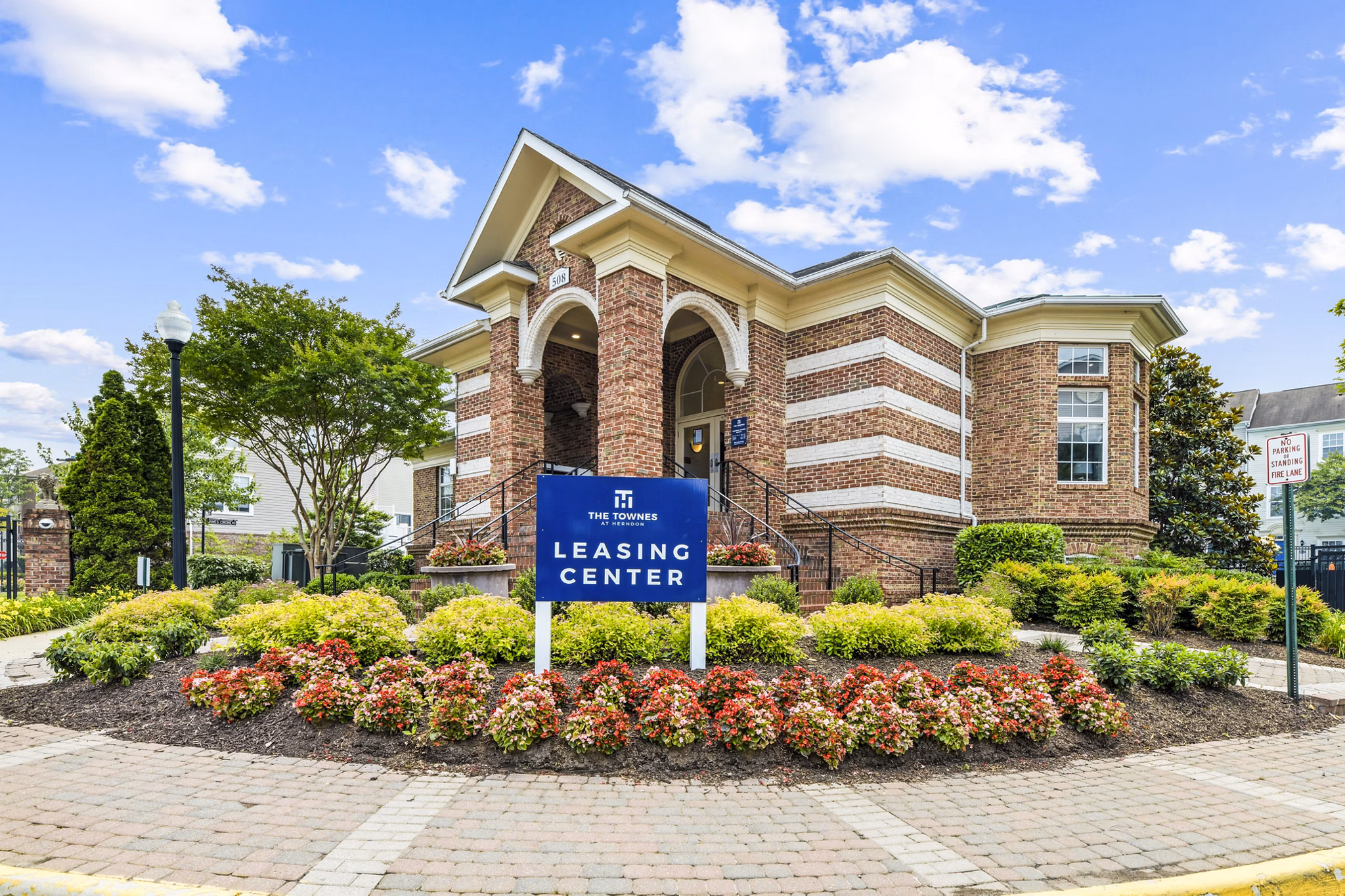 Clubhouse and leasing office at Townes at Herndon Apartments featuring modern design and comfortable seating areas for residents and visitors