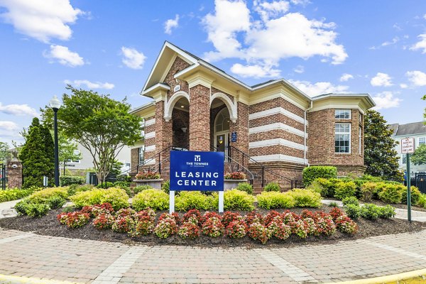 Clubhouse and leasing office at Townes at Herndon Apartments featuring modern design and comfortable seating areas for residents and visitors
